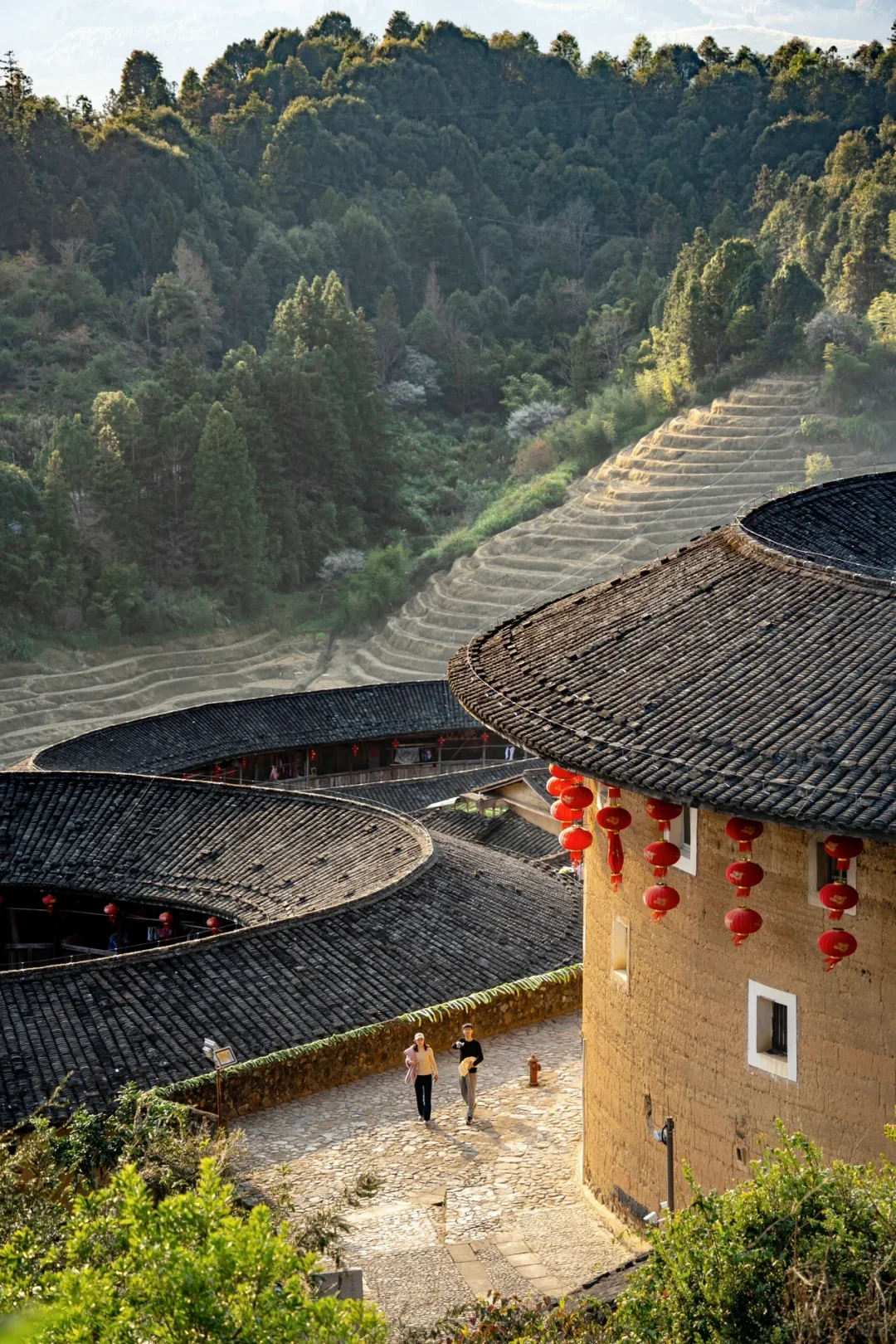 Fujian Tulou rooftops, lanterns and village path