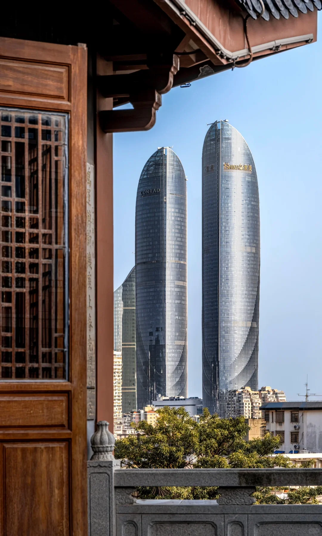 Xiamen twin towers framed by Minnan architecture